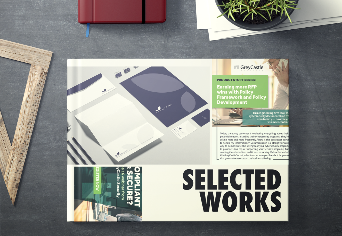 a mockup of a book whose cover contains several graphic design projects and text reading 'selected works'